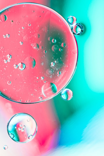 泡とターコイズブルーとピンクの抽象的な背景 無料の写真