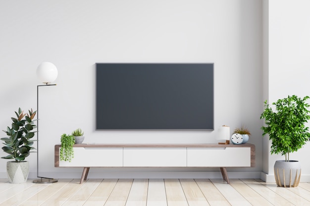 Premium Photo | Tv on the cabinet in modern living room on white wall ...