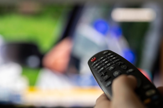 Premium Photo | Tv remote control close up with blurry background