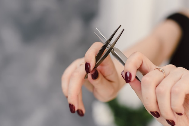 Download Free Tweezers In The Hands Of The Master Eyelash Extension Copyspace Use our free logo maker to create a logo and build your brand. Put your logo on business cards, promotional products, or your website for brand visibility.