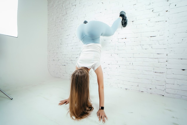 Premium Photo | Twerk woman in blue leggins pants on white background