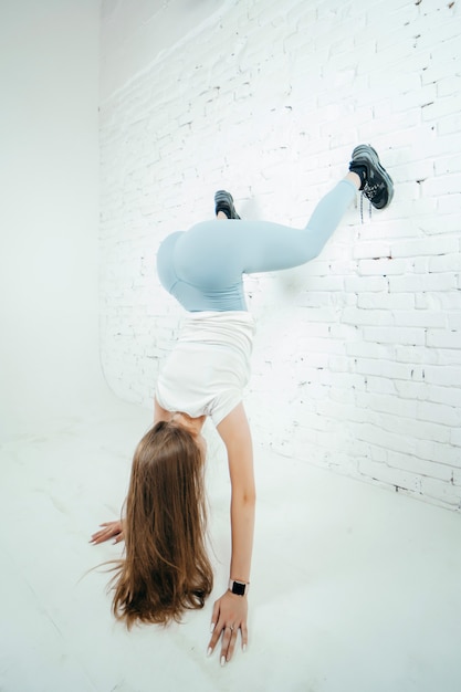 Premium Photo | Twerk woman in blue leggins pants on white background