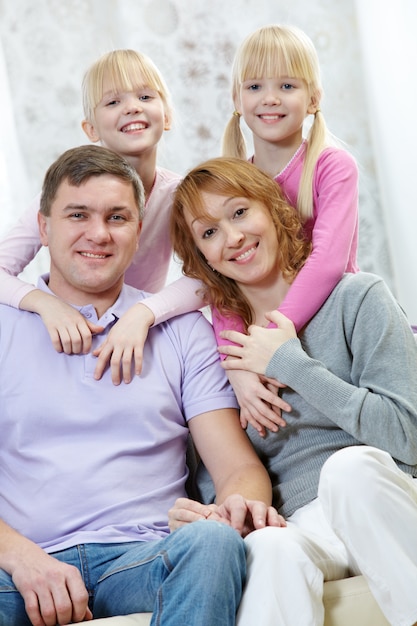 Free Photo | Twin sisters embracing their parents