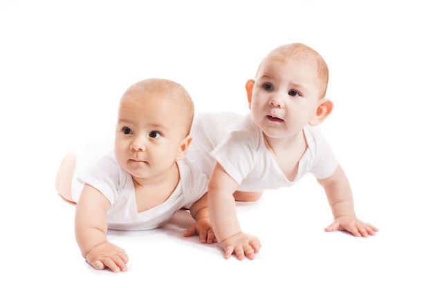 Premium Photo | Two baby boys isolated on white background