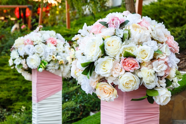 Premium Photo | Two beautiful bouquets of roses outdoors. wedding ...