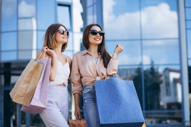 Two beautiful women shopping in town | Free Photo