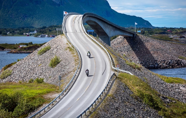 Premium Photo | Two bikers on motorcycles. atlantic ocean road or the ...