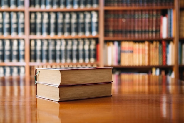 Premium Photo | Two books on library table