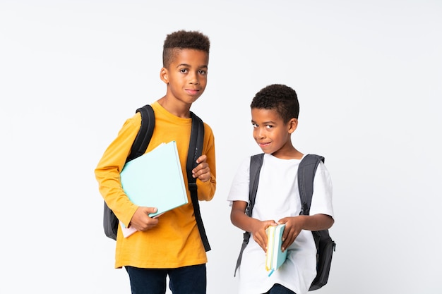 Two boys african american students over isolated white background Premium Photo
