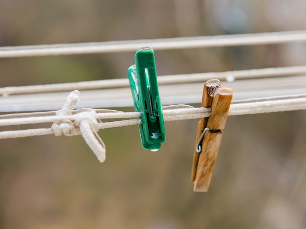 Premium Photo Two Clothespins On A Clothesline Covered With Ice