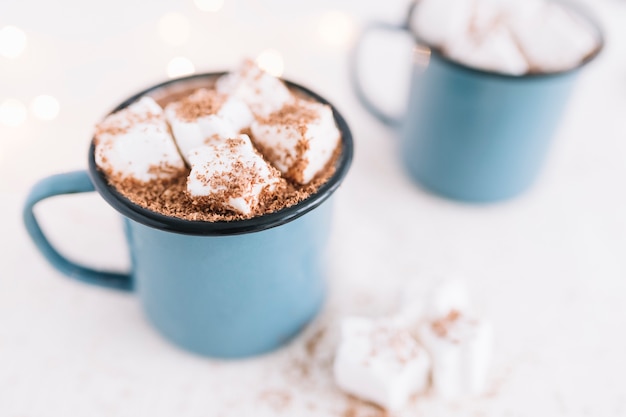 Free Photo | Two cups with cocoa and soft marshmallows