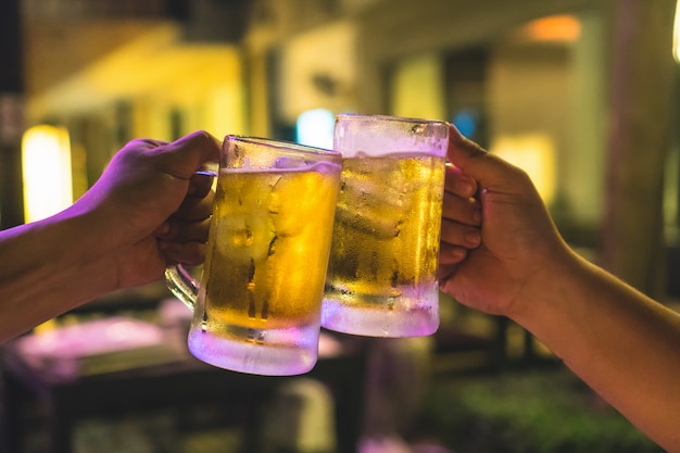 Premium Photo Two Glasses Of Beer Cheers Together Between Friend In