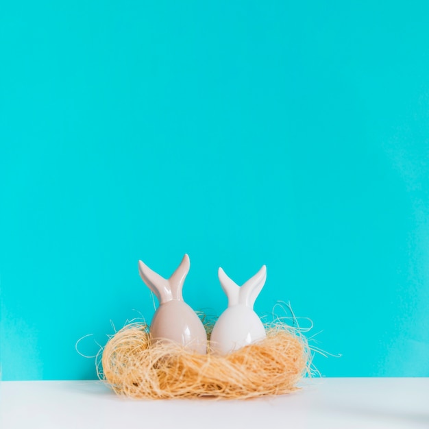 Two hare figurines in nest Free Photo Two hare figurines in nest Free Photo