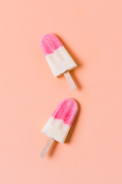 Two ice creams on stick | Free Photo