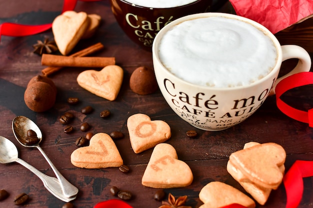 https://image.freepik.com/free-photo/two-large-cups-of-coffee-and-cookies-in-the-form-of-hearts-romantic-breakfast-romantic-valentine-day_106812-320.jpg