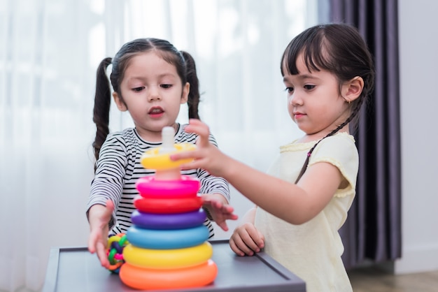 little girls playing with toys