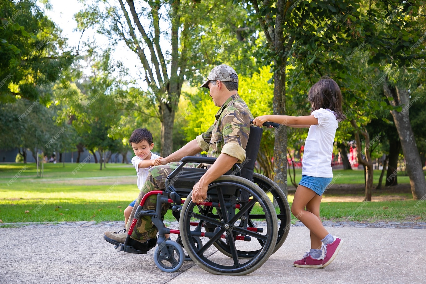 Free Photo | Two little kids walking with military disabled dad in ...