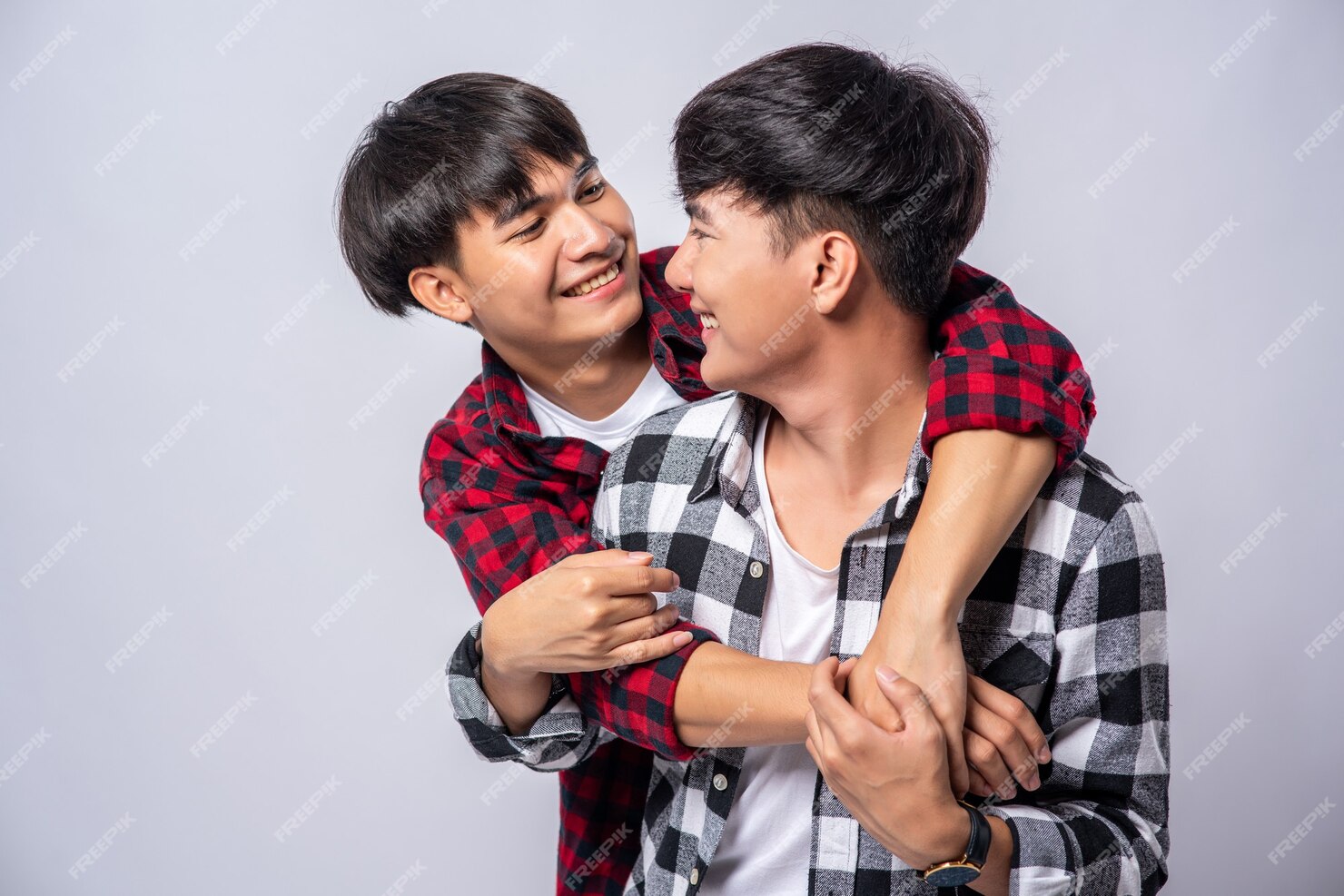 free-photo-two-men-who-love-each-other-hug-from-behind-another