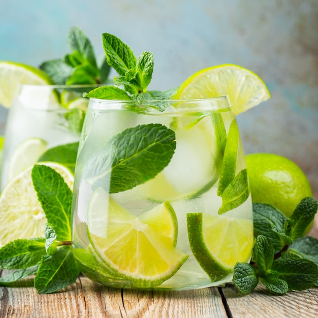 Premium Photo | Two mojito cocktail with ice cubes in a glass.