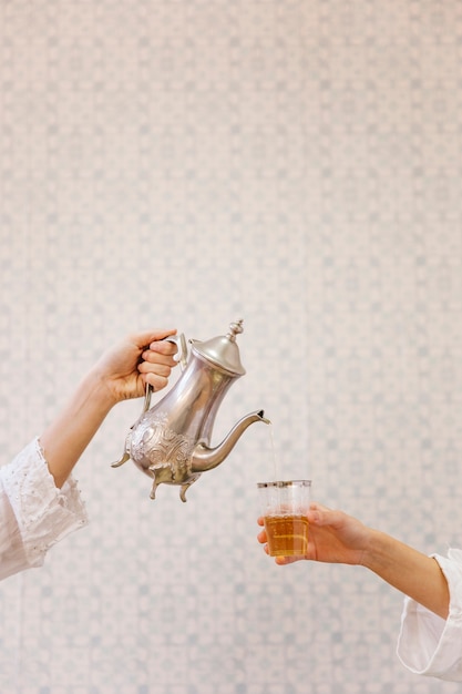 free-photo-two-persons-drinking-arab-tea