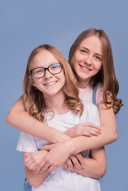 Premium Photo Two Teenager Sisters Having Fun Laughting At Camera Smiling