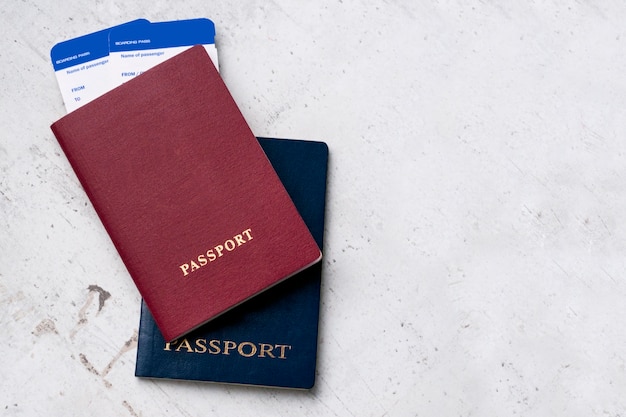 two travelers passports red blue with boarding passes plane 100894 47 - 4 Cara Mudah Cek Status Penerbitan Paspor, Begini Detailnya!