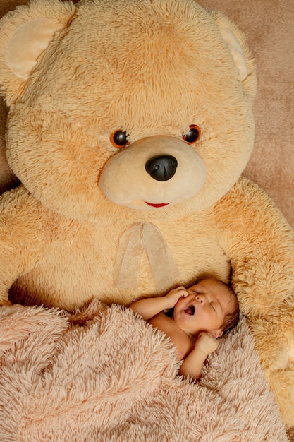 cute baby sleeping with teddy