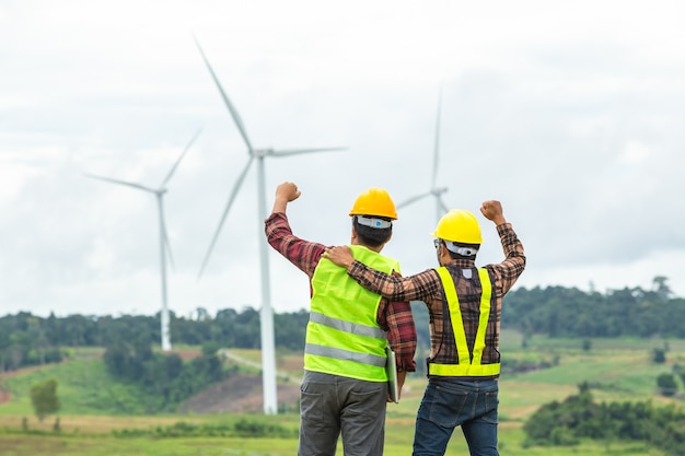 Premium Photo | Two windmill engineer inspection and progress check ...