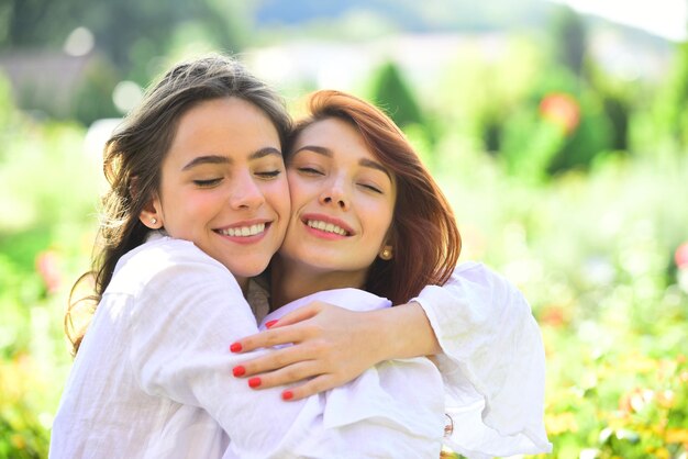 Premium Photo | Two women friends laughing and hugging outdoors girls love