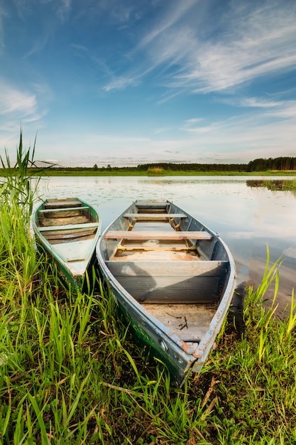 Premium Photo | Two wooden boats in a river landscape