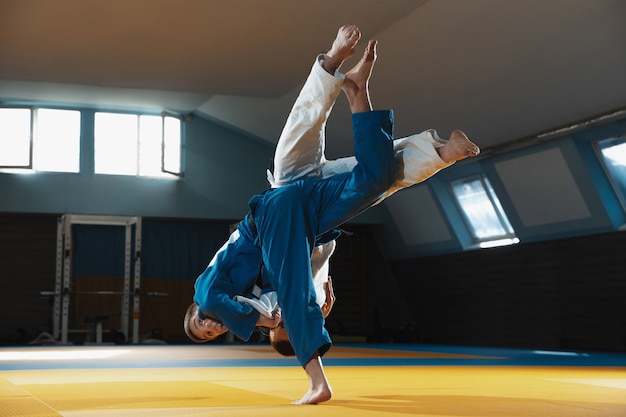 Free Photo | Two young judo fighters in kimono training martial arts in ...