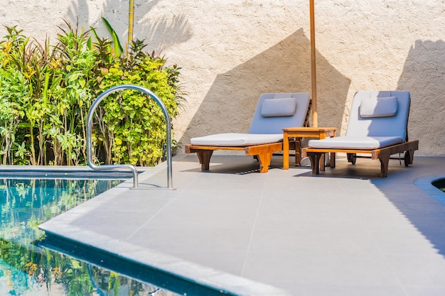 Umbrella And Chair Around Swimming Pool Neary Sea Ocean