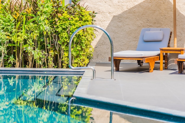 Umbrella And Chair Around Swimming Pool Neary Sea Ocean