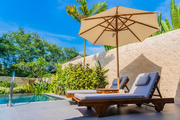 Umbrella And Chair Around Swimming Pool Neary Sea Ocean