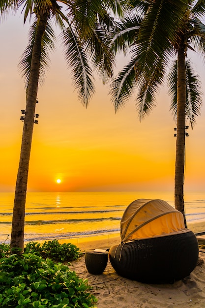 Free Photo Umbrella And Chair On The Beautiful Beach And Sea At Sunrise Time For Travel And Vacation