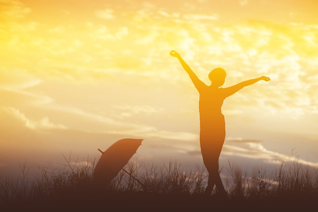 Premium Photo | Umbrella woman and sunset silhouette