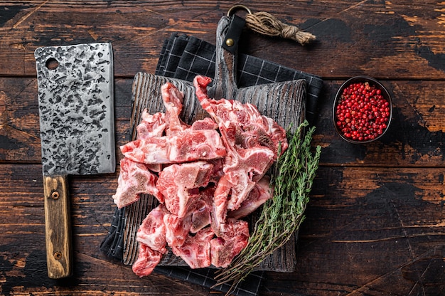 Premium Photo | Uncooked raw meat diced for stew on a butcher board