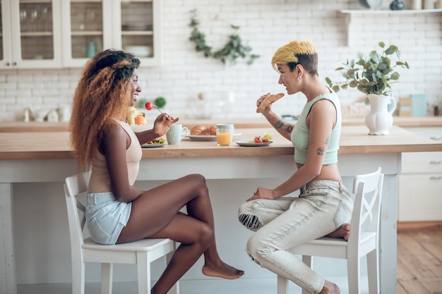 premium-photo-understanding-two-young-cute-happy-girlfriends-sitting