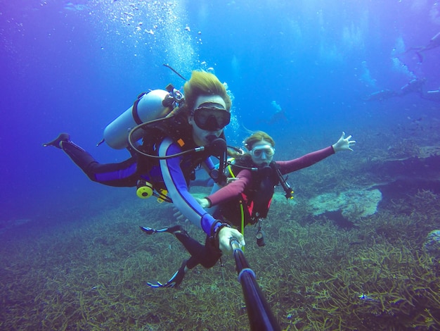 Free Photo | Underwater scuba diving selfie shot with selfie stick