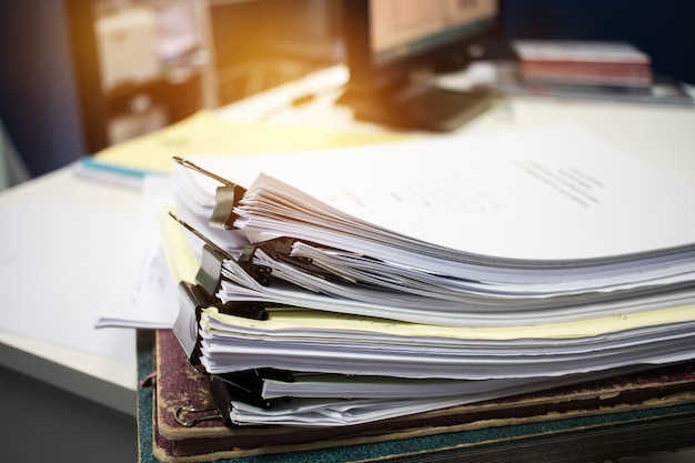 Unfinished Documents Stacks Of Paper Files On Office Desk For