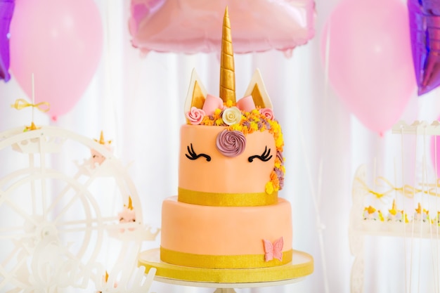 Download Premium Photo Unicorn Layered Cake Decorated With Flowers And Butterfly Pink Background