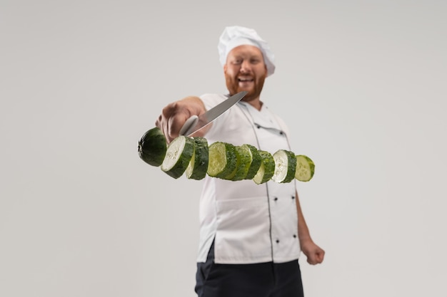 Unique cutting of vegetables. one hadsome bearded man cooking Free Photo