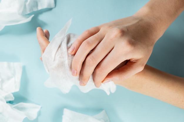 Premium Photo | Unreasonable plastic pollution concept: excessive use of  wet wipes. close-up view hands getting cleaned with lots of moist tissues