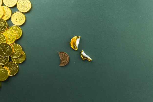 Unwrapped treat near pile of coins Free Photo Unwrapped treat near pile of coins Free Photo