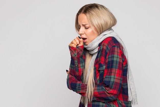 Premium Photo | Upset young woman in checked shirt, wrapped in scarf ...