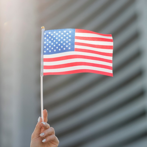 Premium Photo Usa Flag Held By Hand 6750