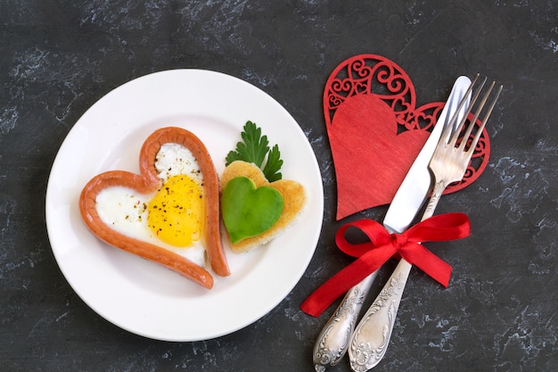 Premium Photo | Valentine's day breakfast is scrambled eggs with heart ...