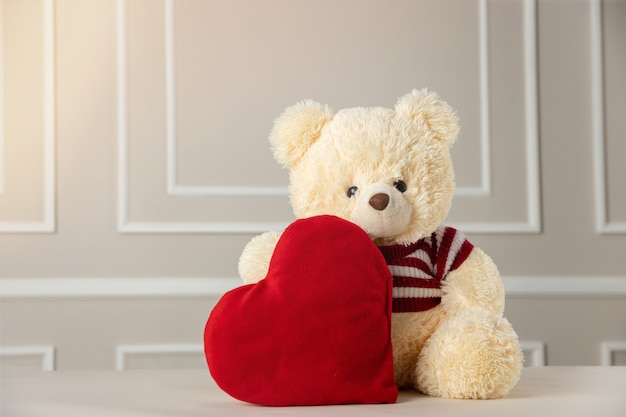 stuffed bear holding a heart