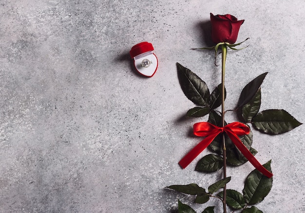 Valentines day marry me wedding engagement ring in box with red rose gift Free Photo