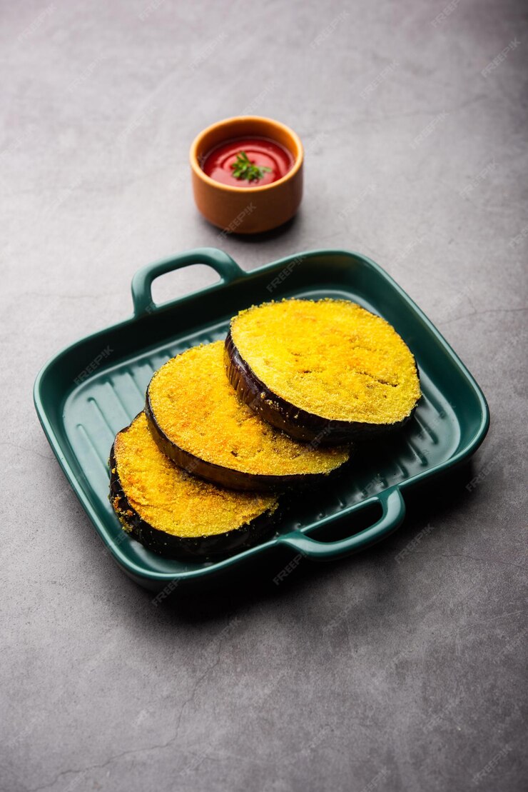 Premium Photo | Vangyache kaap or pan fried crispy eggplant, indian ...